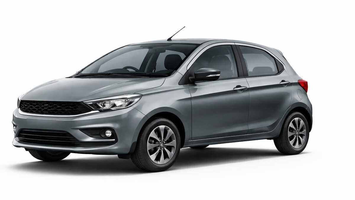 Tata Tiago XM hatchback car front side view in daylight