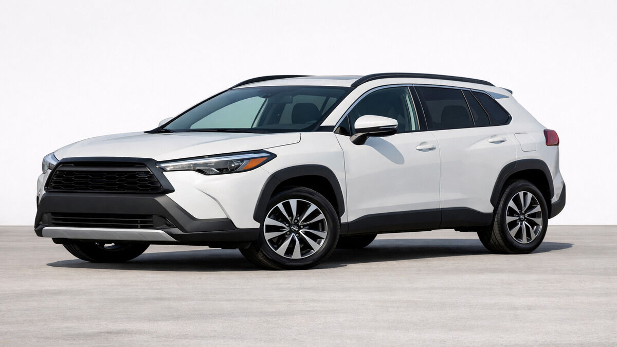 Toyota Corolla Cross compact SUV on a clean plain background, front-side angle